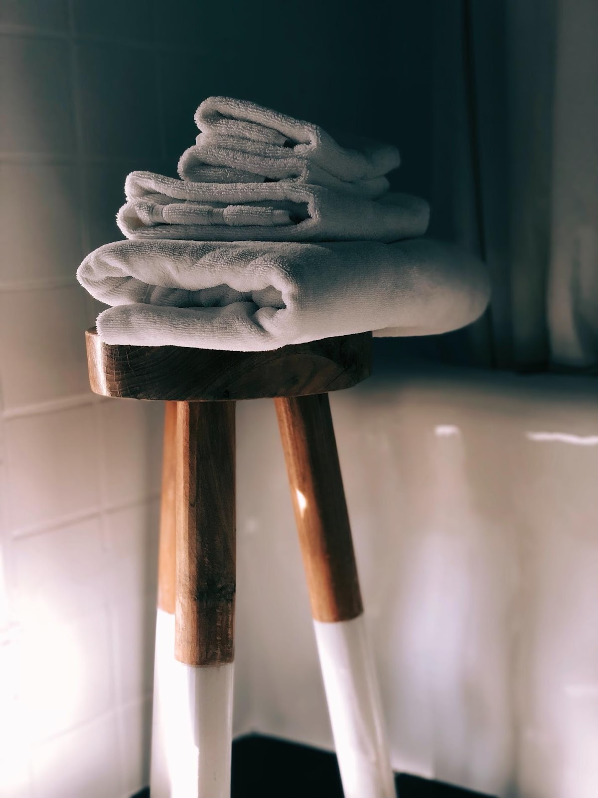 towels on a stool in the bathroom